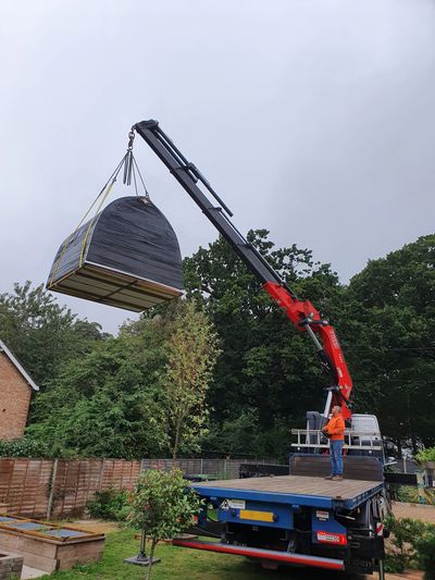 Glamping Pod being picked up by hiab