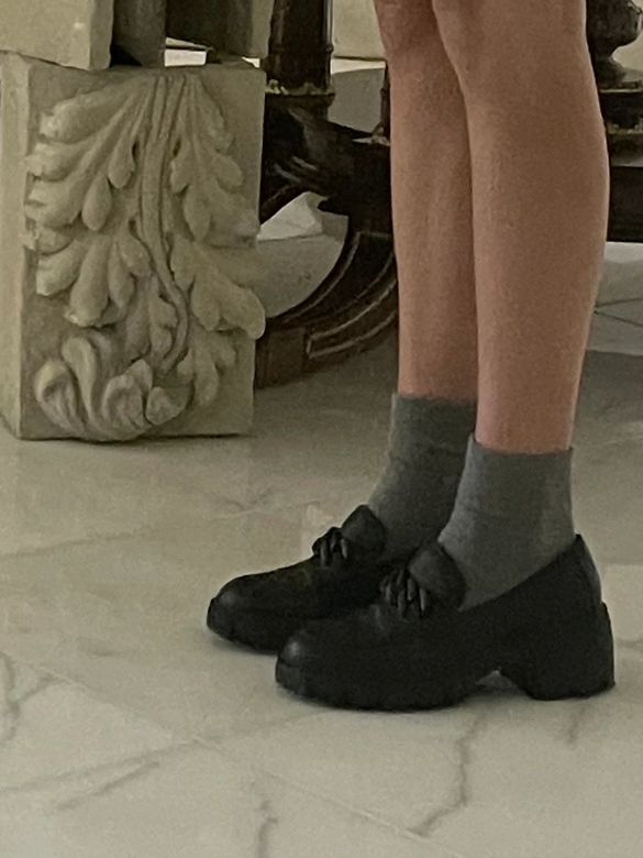 fancy black loafer shoes with gray socks