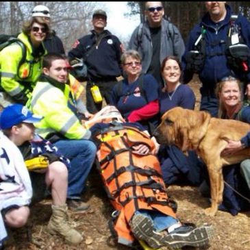 Working Dog and man trailing bloodhound, Tracker, locates 2 missing children.