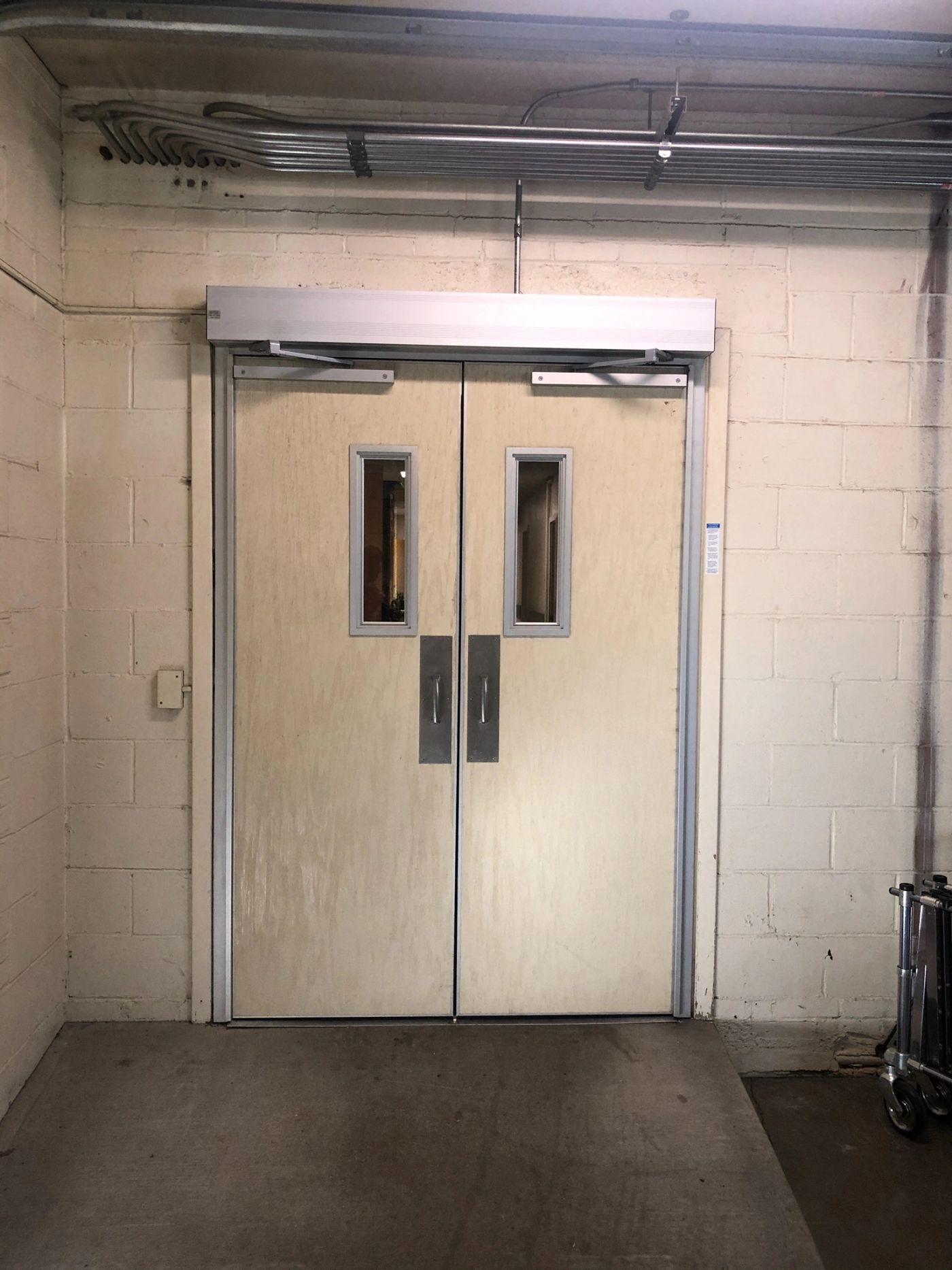 Interior double doors with an overhead automatic operator