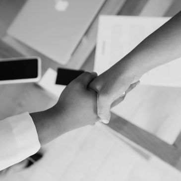Picture of a handshake. Pocketbook Referral Agency helps you find the perfect assistant.