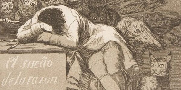 An exhausted figure leans over a desk surrounded by ominous owls and cats.