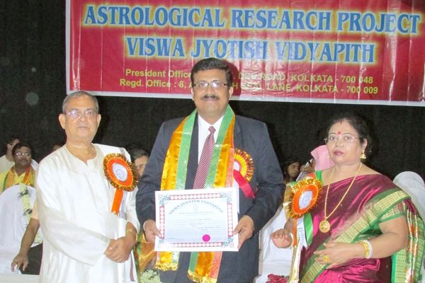 Dr. Subrata Chatterjee receiving Ph.D. certificate from Viswa Jyotish Vidyapith—an honor earned.
