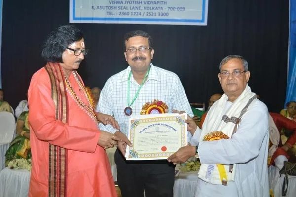 Dr. Subrata Chatterjee, Vedic & KP astrologer, honoured with Gold Medal and Certificate.