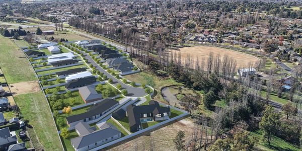 Aerial view of a suburban neighborhood with houses and trees.