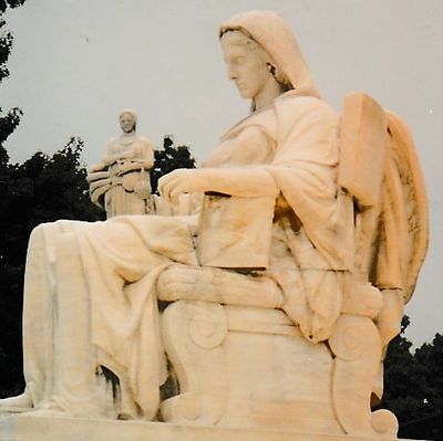 A big statue of a woman on display of the website