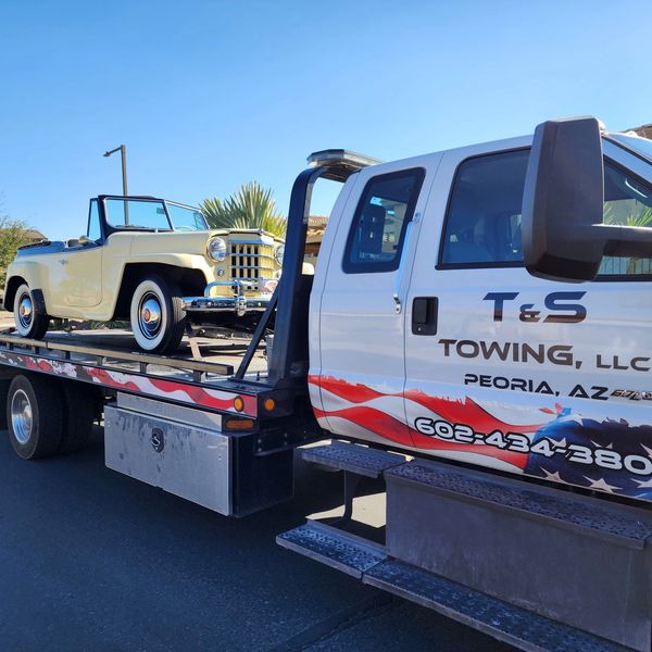 Classic show car being towed