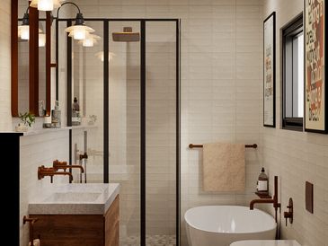 Luxury bathroom design featuring a black frame shower, warm brass tapware and a custom vanity.