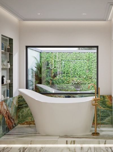 Modern bathroom with freestanding bathtub and large window overlooking greenery.