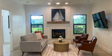 Cozy modern living room with fireplace.