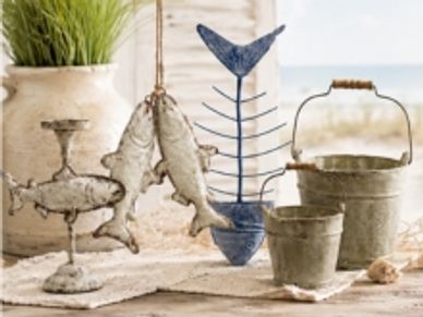 Decorative fish-themed metal ornaments and buckets.
