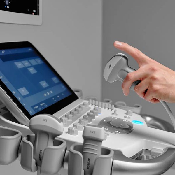 Sonographer holding ultrasound probe for diagnostic and elective ultrasound. 
