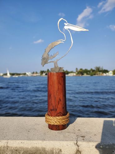 This beautiful metal pelican is made from 11 gauge steel that has a gorgeous rustic patina on it.