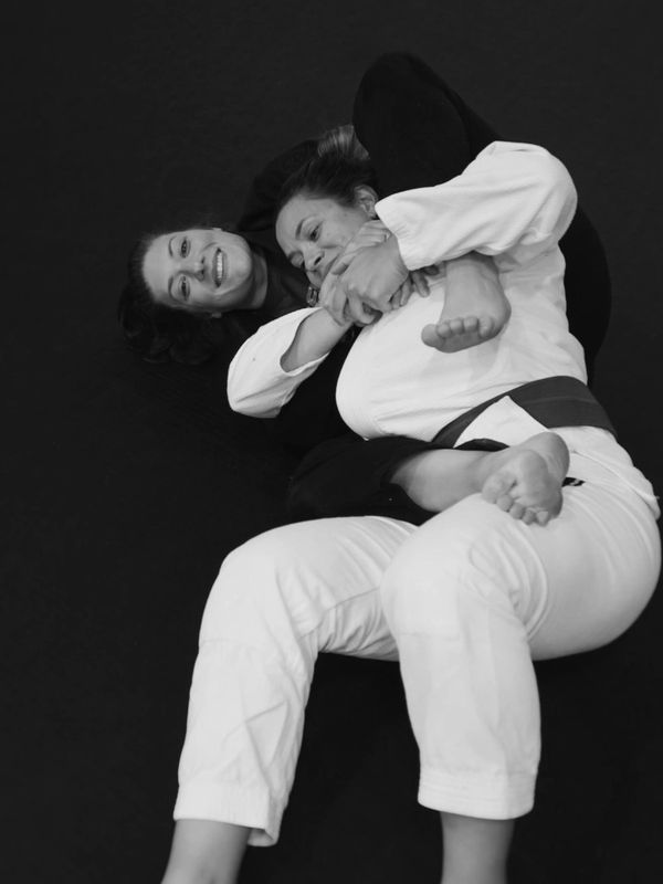 Naomi taking the back at jiujitsu