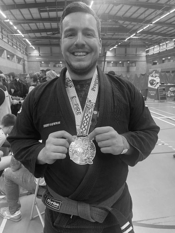 Sam with gold medal at competition. 