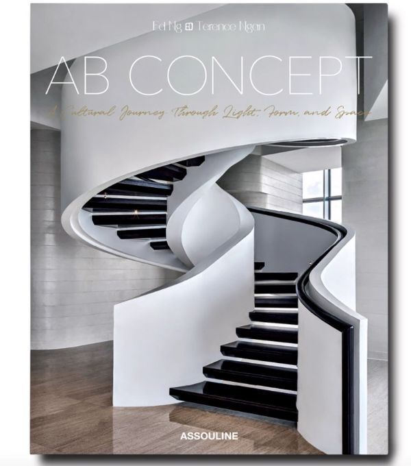 A modern white spiral staircase with black steps in a minimalist setting.