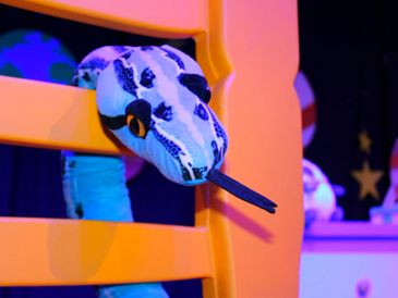 Sid the Snake, adventurer and sneakiest of the toys in Lights Out, kids theatre show.