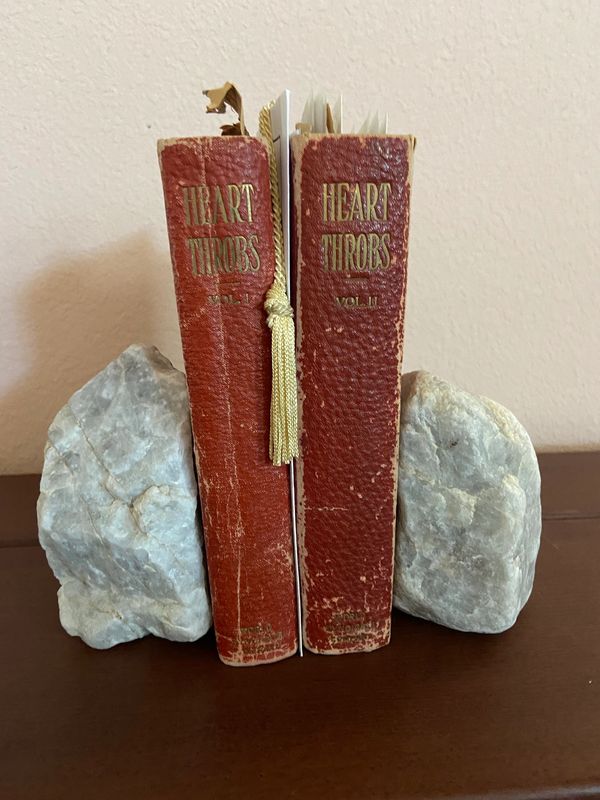 "PARTNERS" Stone Set holding antique books as bookends.