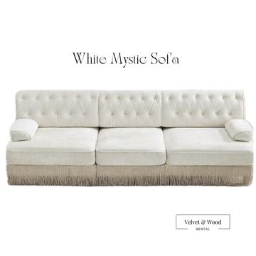 Rusty Mystic Sofa with tufted back and fringe base.