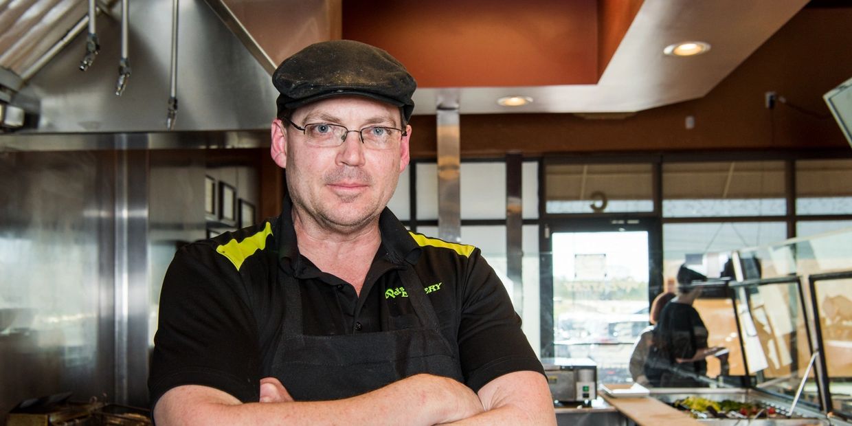 A Person in a Black and Yellow and Black Color Chef Uniform