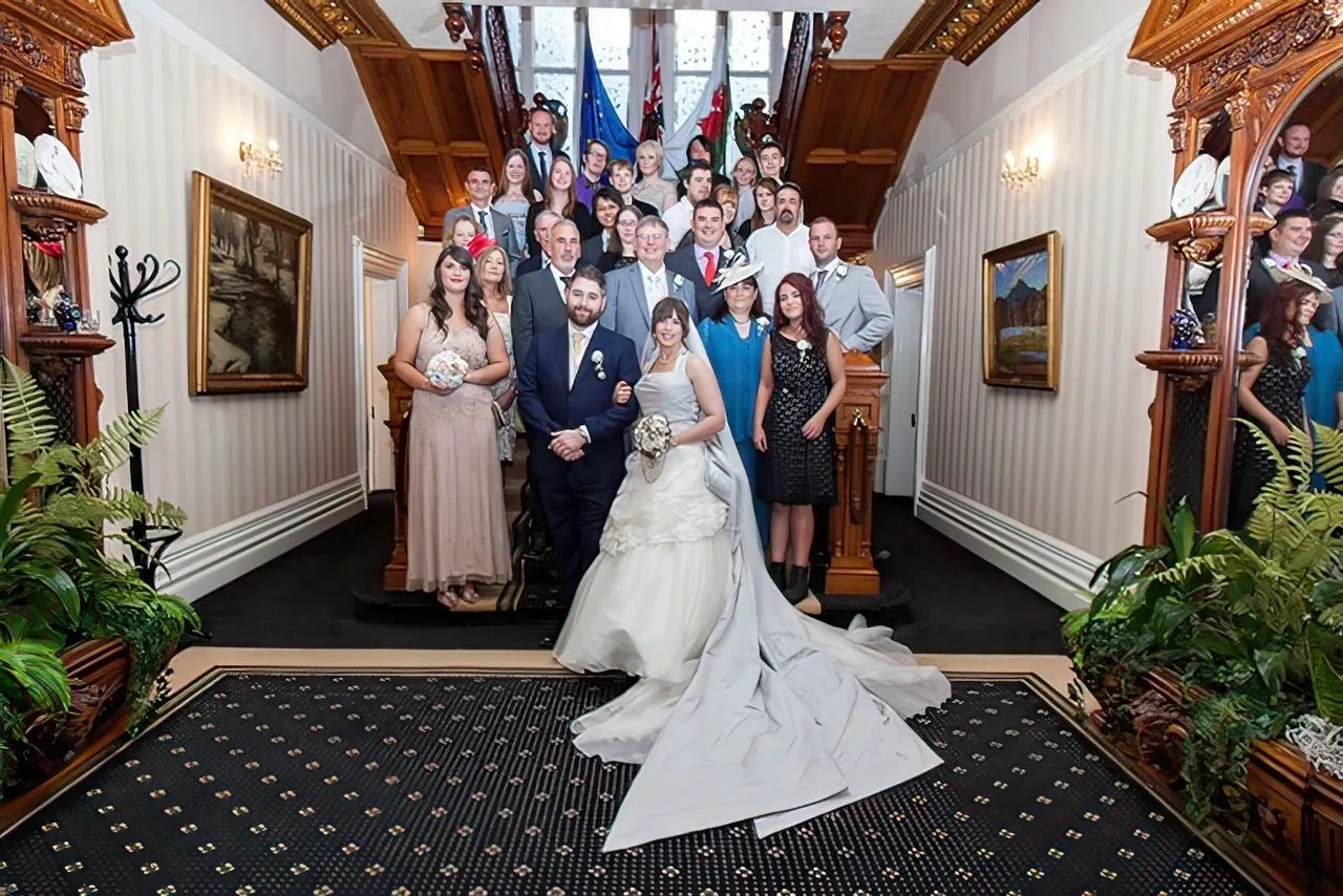 Bride and groom at Mansion House Cardiff grand staircase