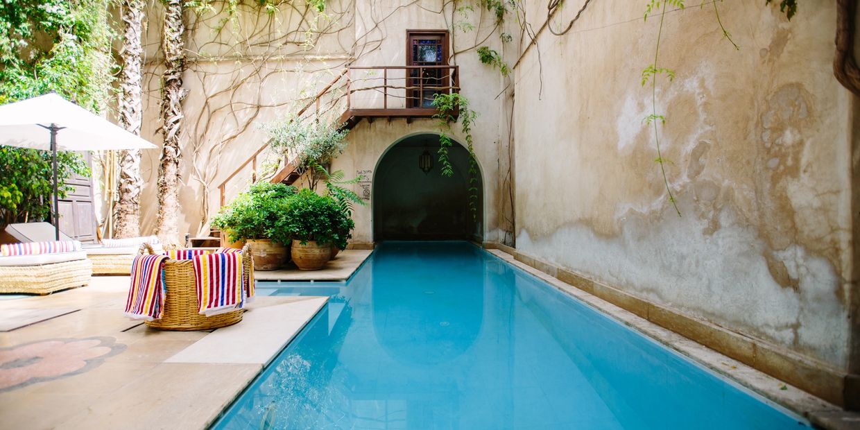 A boutique hotel with a pool .
