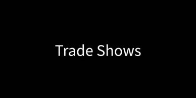 Text on black background saying 'Trade Shows'.
