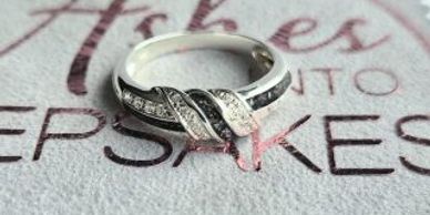 Silver ring with diamond accents.