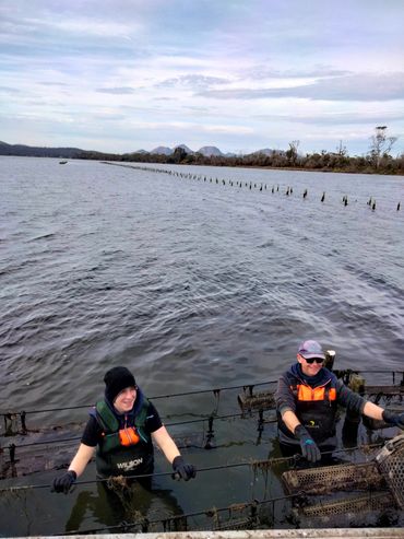 Charlie our son and Ian in swan river working