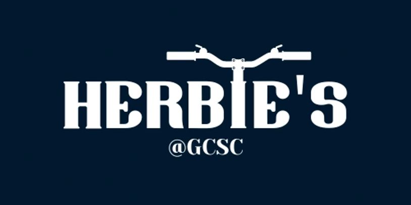 White text logo for Herbie's with bicycle handlebars on a dark blue background.