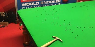 fitting a cloth on a snooker table