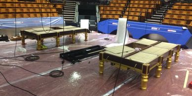 snooker tables being set up