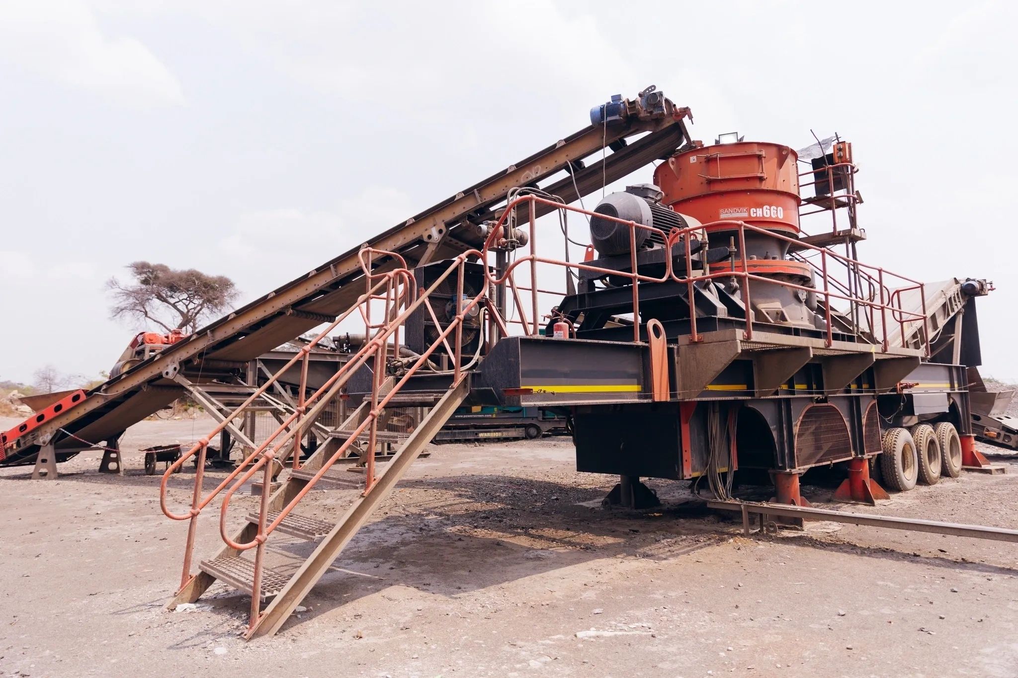 Industrial sand and gravel processing equipment outdoors.