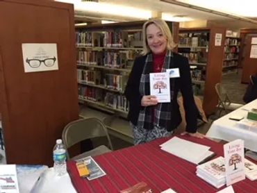 a woman holding a book