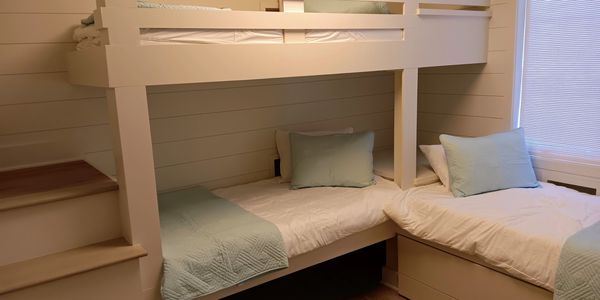 Custom Built in trundle bed and shiplap.