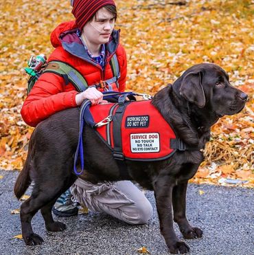 Kelsey with therapy dog Hunter 