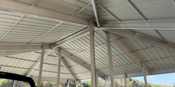 Metal roof structure with beams and supports.