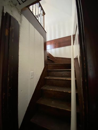 Wooden staircase to upper 3 BR’s