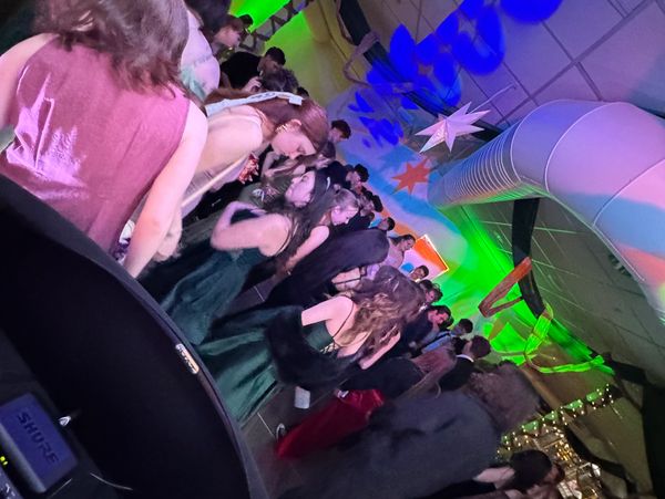 Packed prom dance floor with high-energy DJ lighting and sound by RNS DJs, bringing unforgettable vi