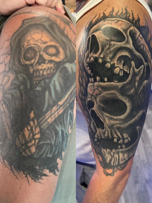 Shoulder cover up tattoo of dark skulls