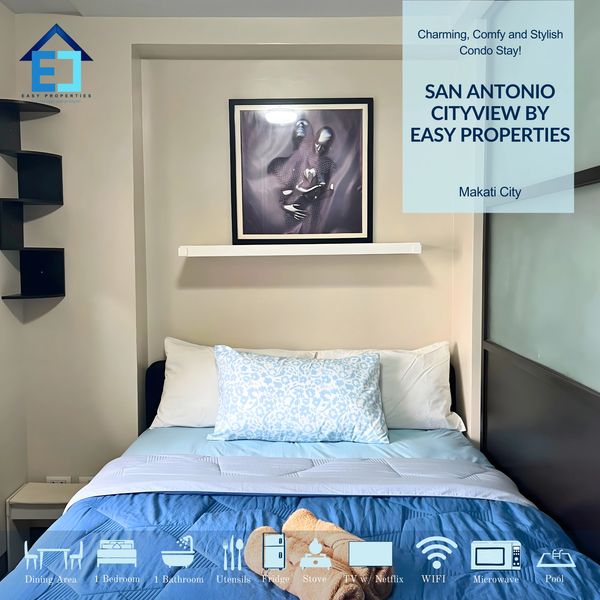 Cozy bedroom with blue bedding and modern decor in a Makati City condo.