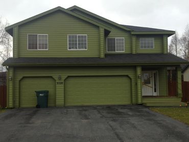 Exterior home painted with Sherwin Williams paint, applied by Alaska's Supreme Painting Co.