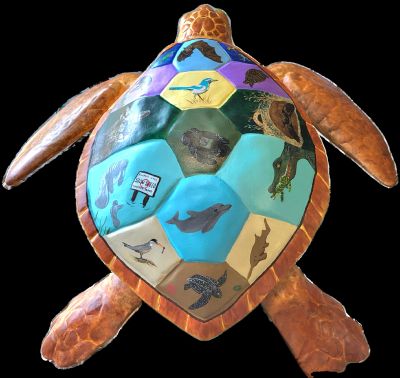Turtle sculpture with colorful hexagonal sections depicting various animals.