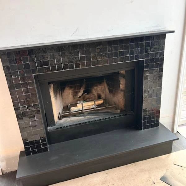 Black Zellige tiles fireplace