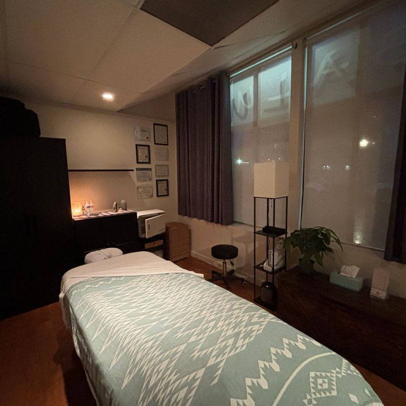 Treatment room massage table cozy and warm space used for RMT treatments yoga studio 