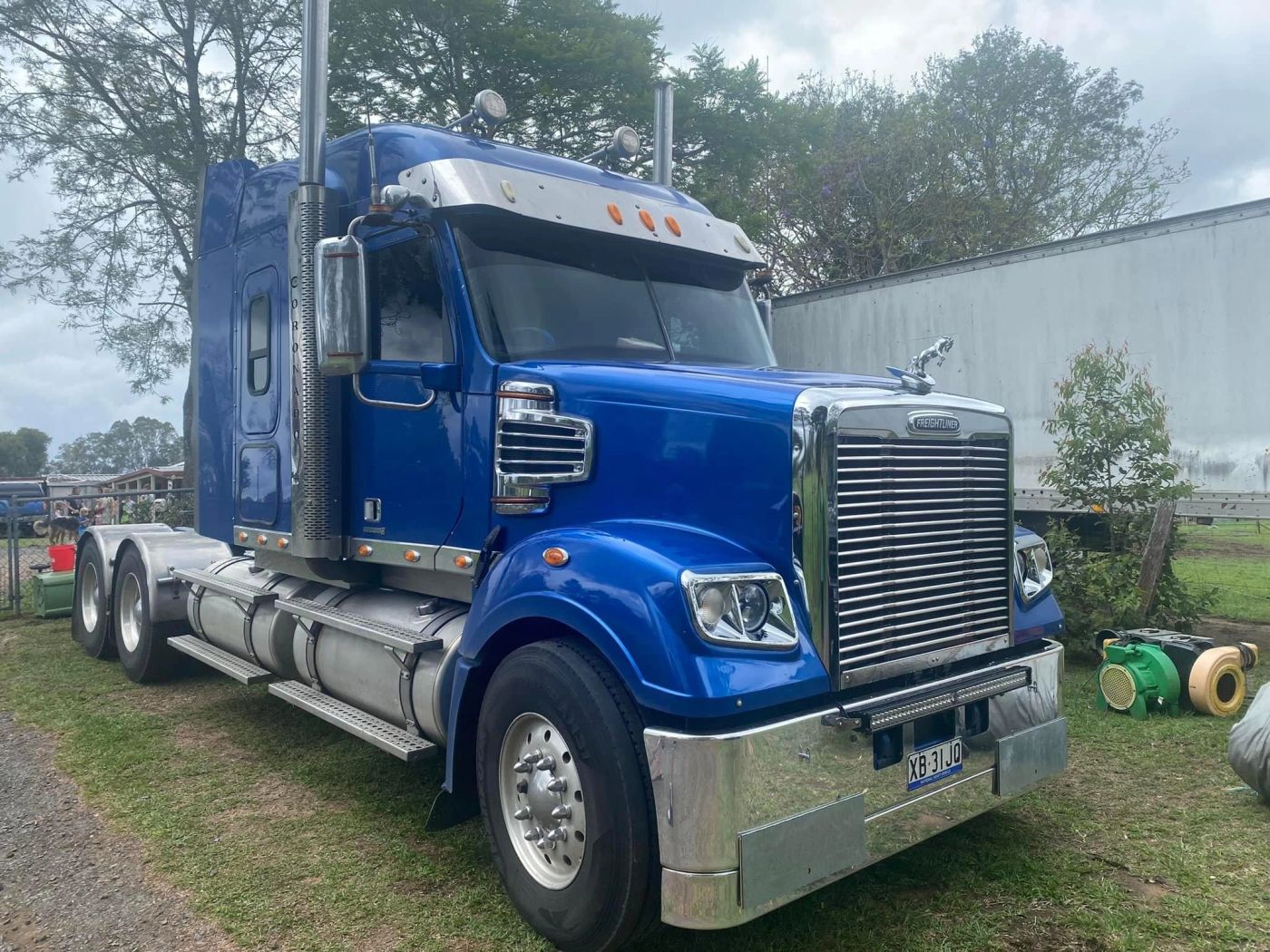 Blue Kenworth truck with tinted cab