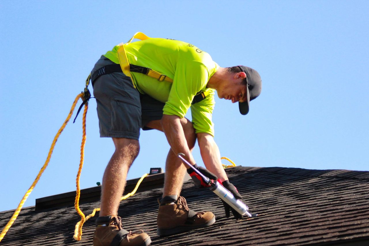 Contractors working on a rooftop.