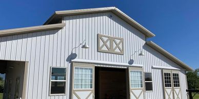 Pole building with fancy sliding doors.  Horse friendly pole barn in Marriott Slaterville.