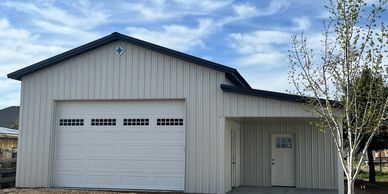 Classy white and charcoal pole barn.  Pole building located in Hooper, UT