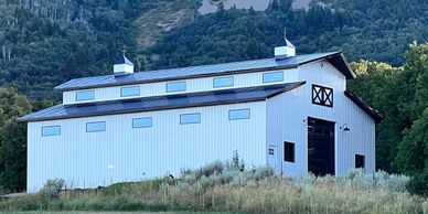 Beautiful pole barn on mountain lot in Wellsville, UT.  Pole building with raised center trusses.